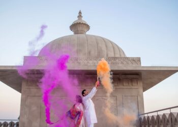 A couple celebrating Holi