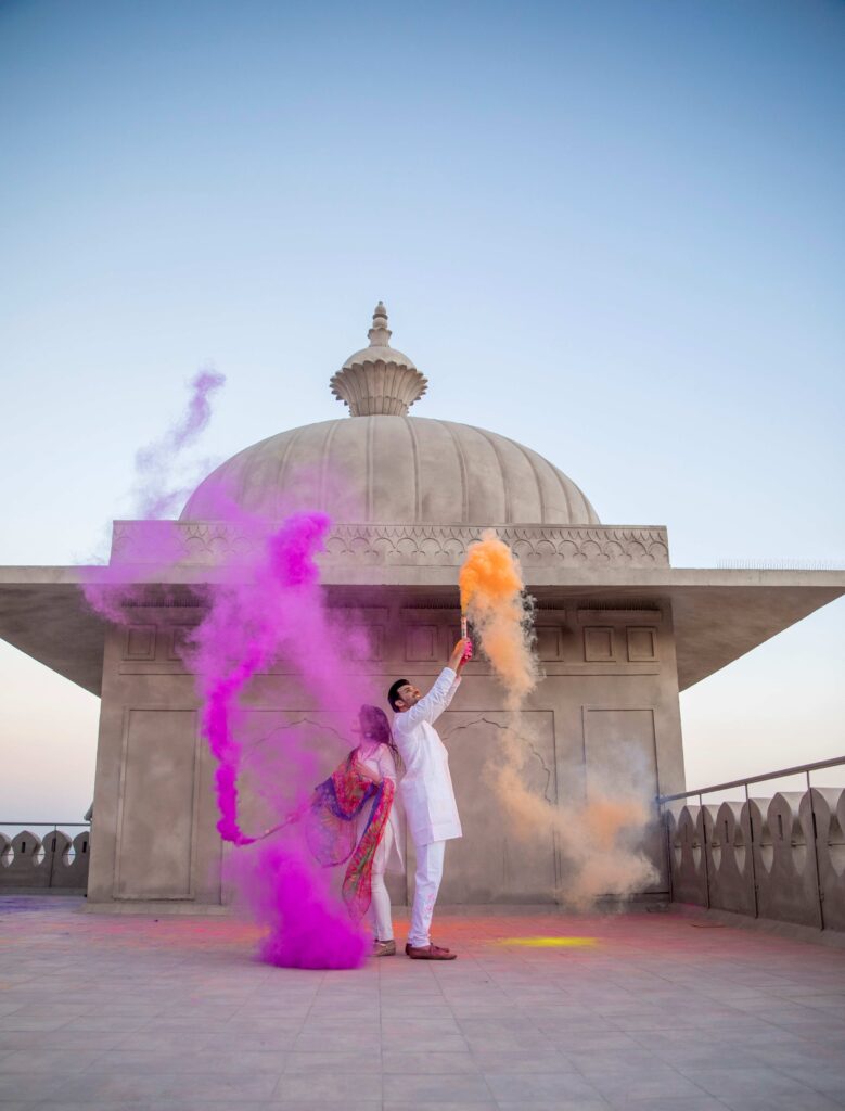 A couple celebrating Holi